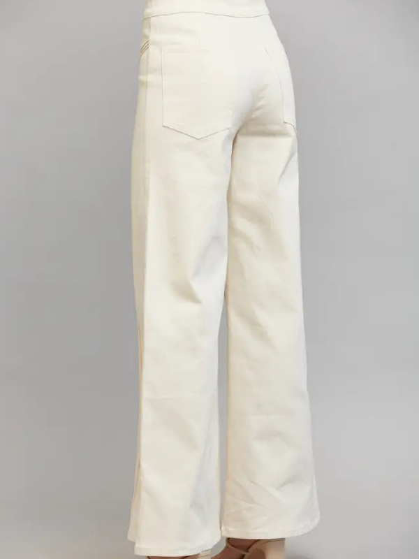 Off-white wide-leg trousers shown from the back, featuring a single back pocket and a high waistband, photographed against a neutral gray studio background.