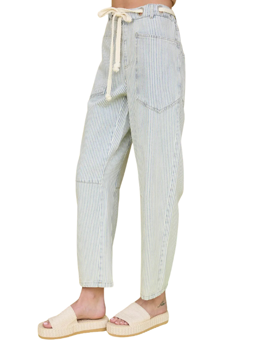Striped pants worn by a person on a white background