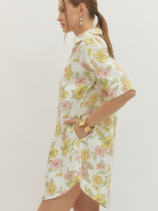 Woman wearing a floral dress against a white background