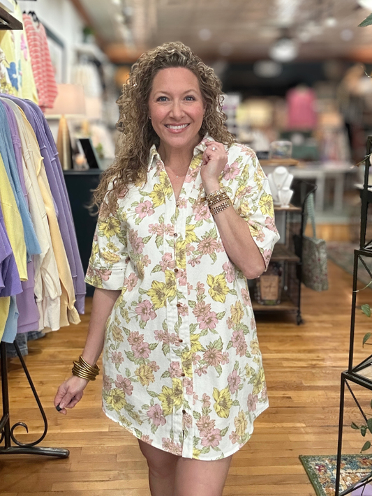 Woman wearing a floral dress in a clothing store