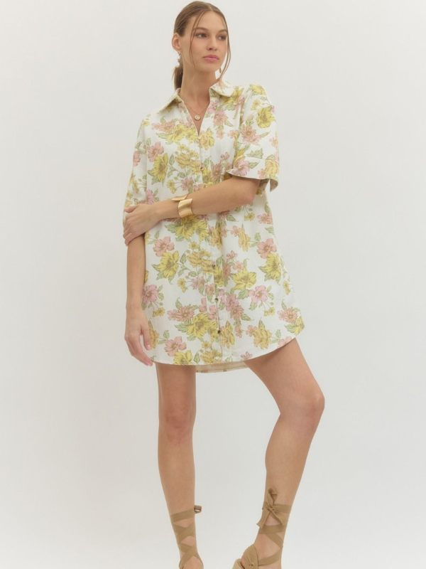Woman wearing a floral dress on a white background
