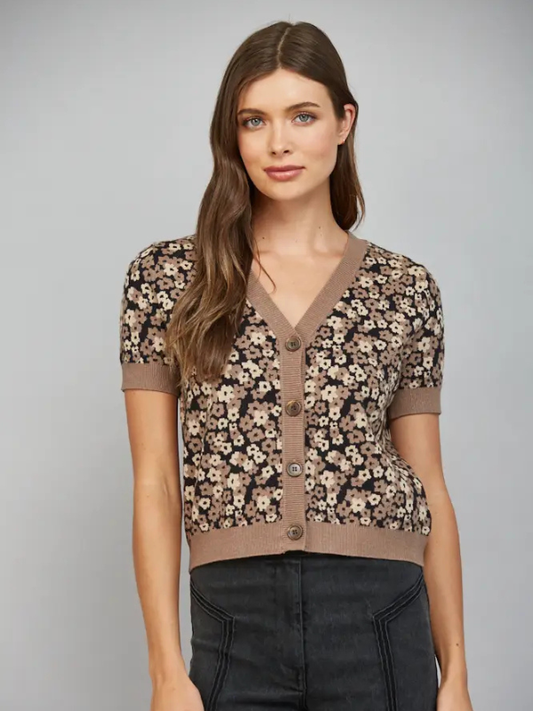 woman wearing a short sleeve black and brown leopard look cardigan 
