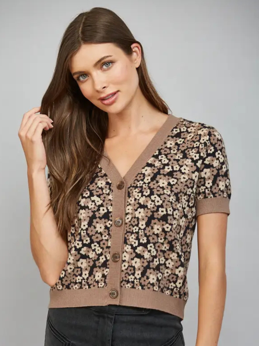 woman wearing a short sleeve black and brown leopard look cardigan 