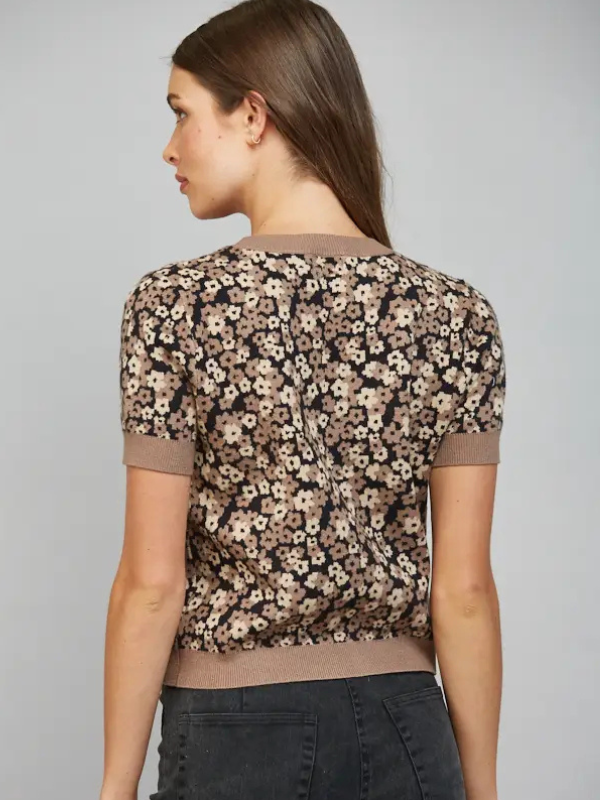 woman wearing a short sleeve black and brown leopard look cardigan 