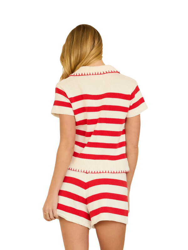woman wearing a red and cream striped top and shorts. 
