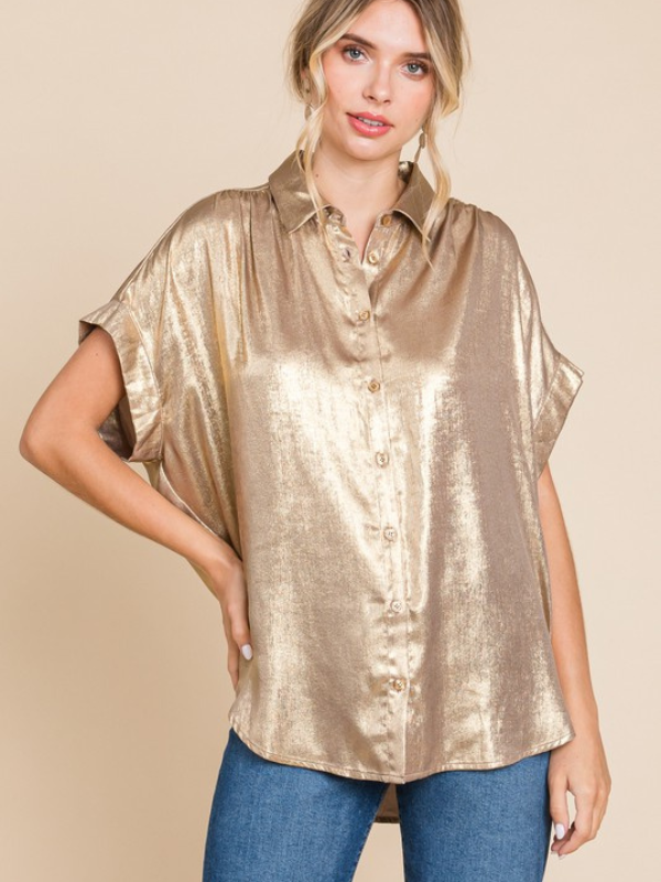woman wearing gold metallic shirt