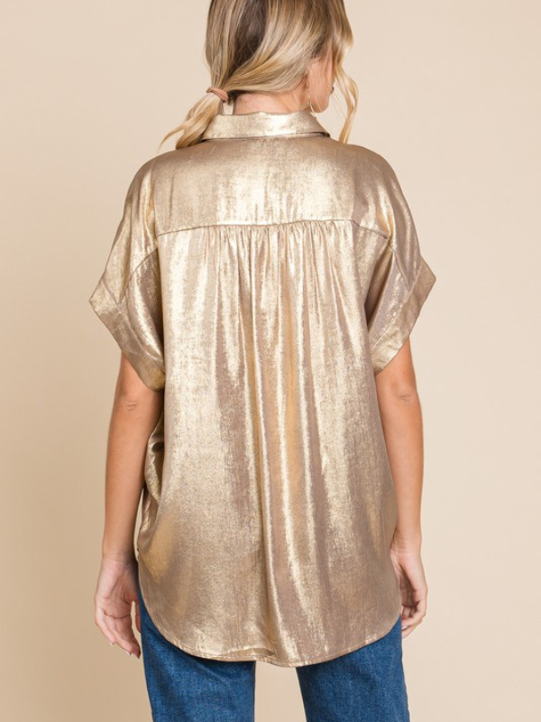 woman wearing gold metallic shirt