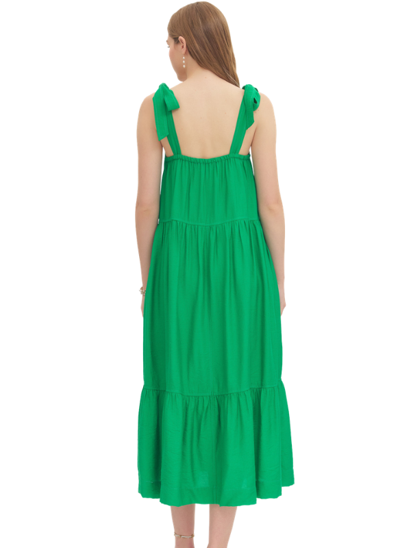 Green dress with white patterns on a white background
