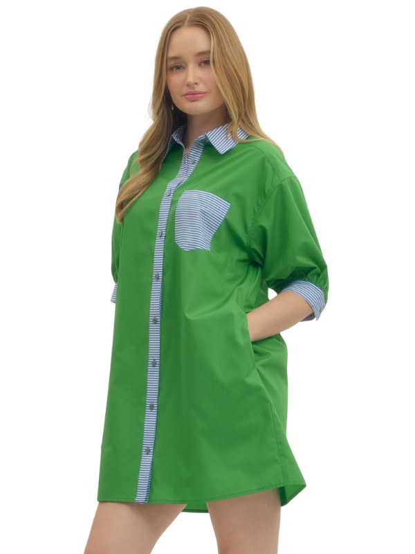 Green shirt with white and blue striped accents worn by a model on a white background