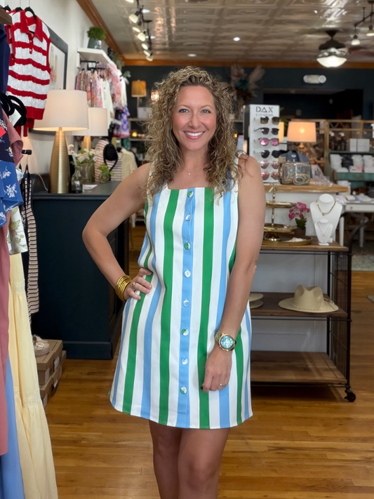 Woman in a striped dress standing in a store