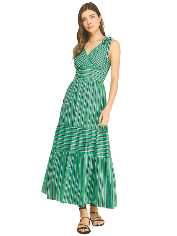 Woman wearing a green striped dress on a white background