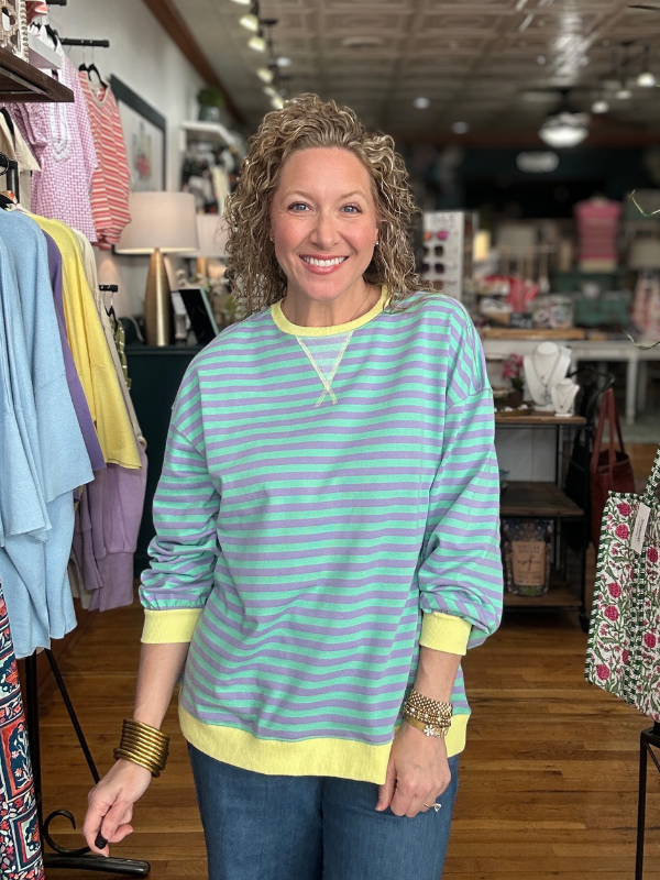 Woman wearing a striped shirt in a clothing store