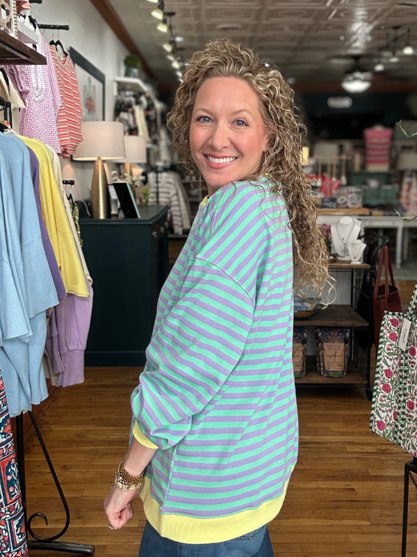Woman wearing a striped shirt in a clothing store