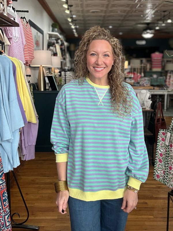 Woman wearing a striped shirt in a clothing store