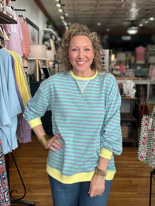 Woman wearing a striped shirt in a clothing store