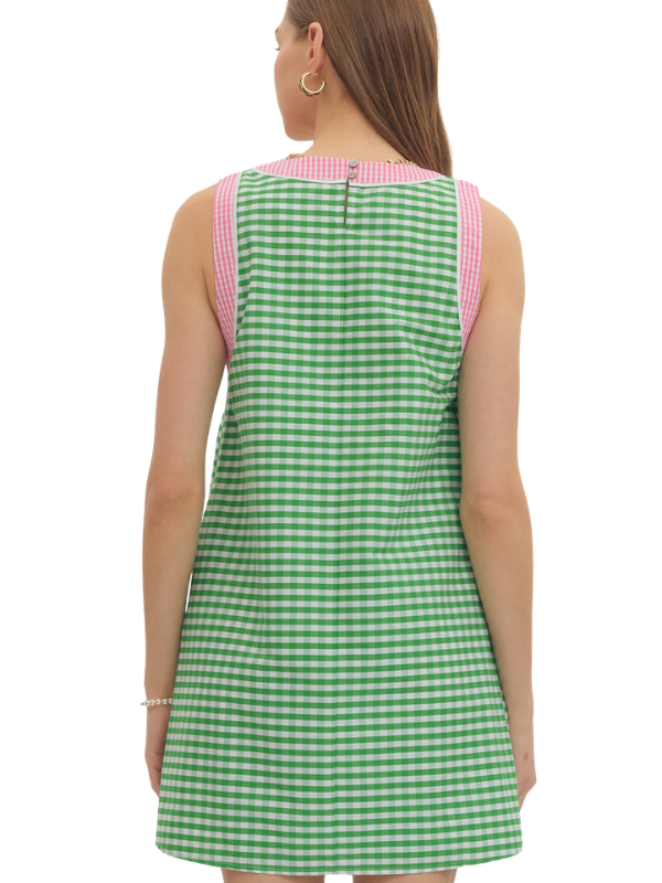 Green checkered dress with pink accents on a white background