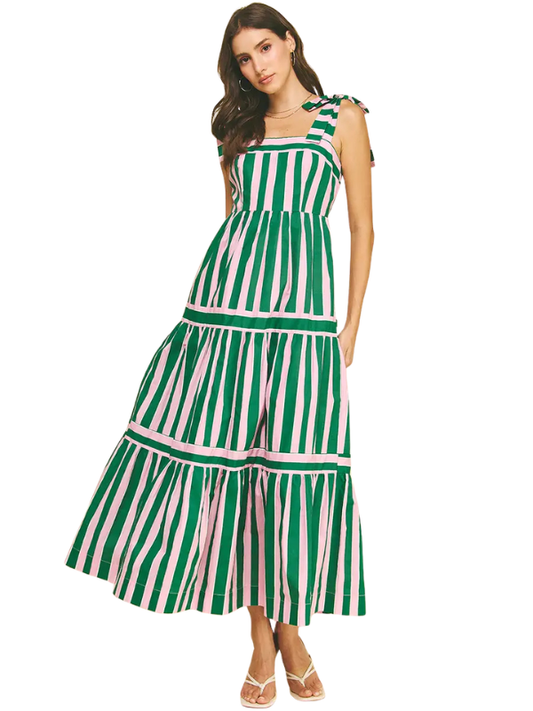 Woman wearing a green and pink striped dress on a white background