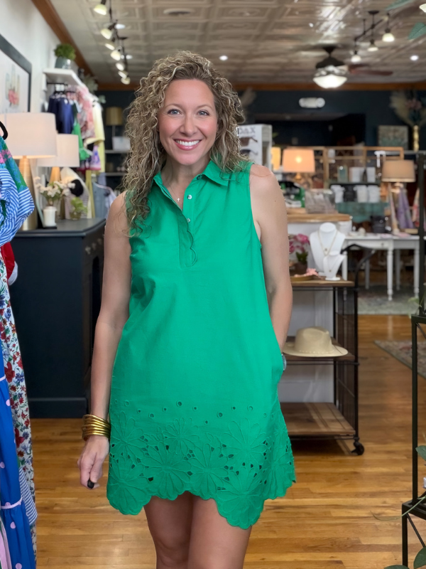 woman wearing a green dress in a store 