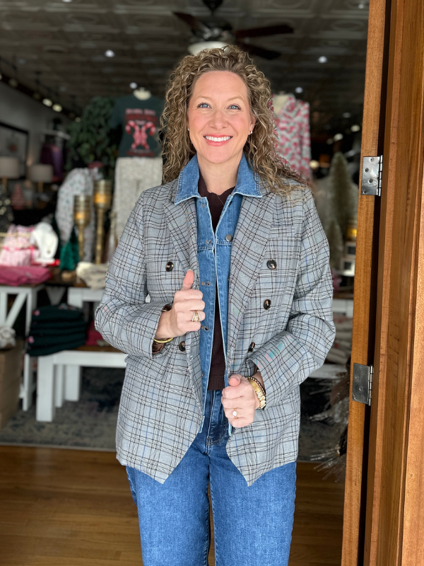 Woman giving a thumbs-up in a store setting
