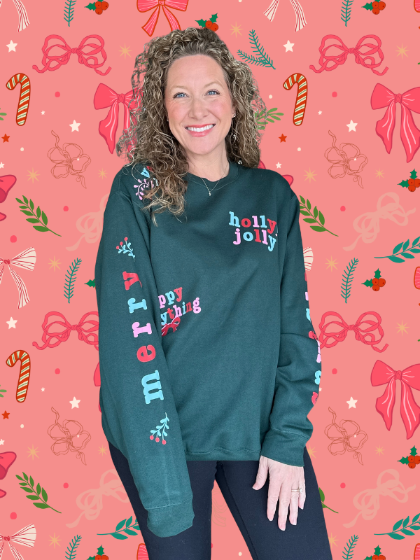 Person wearing a teal hoodie with Christmas-themed text on a festive background