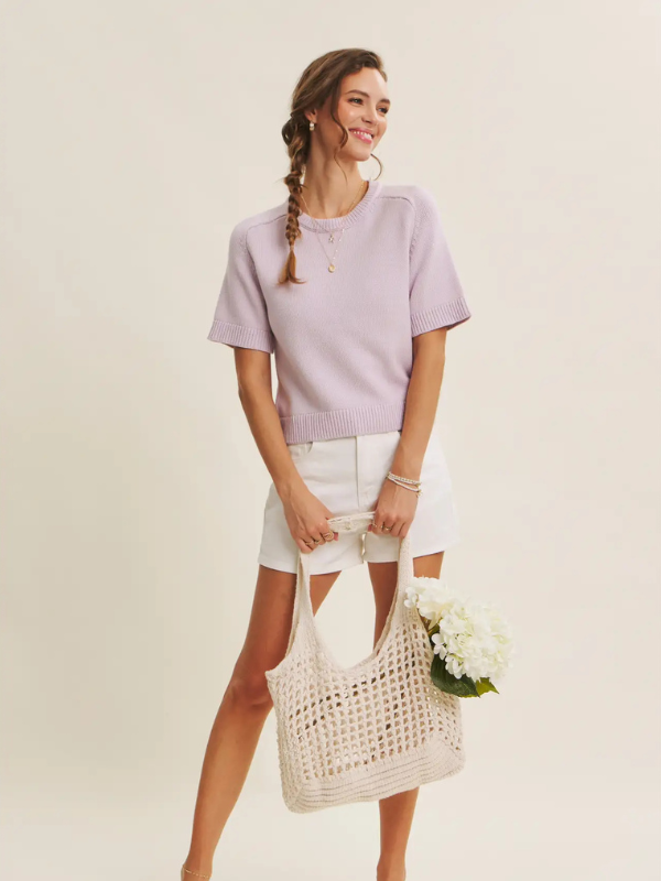 woman wearing lavender soft top