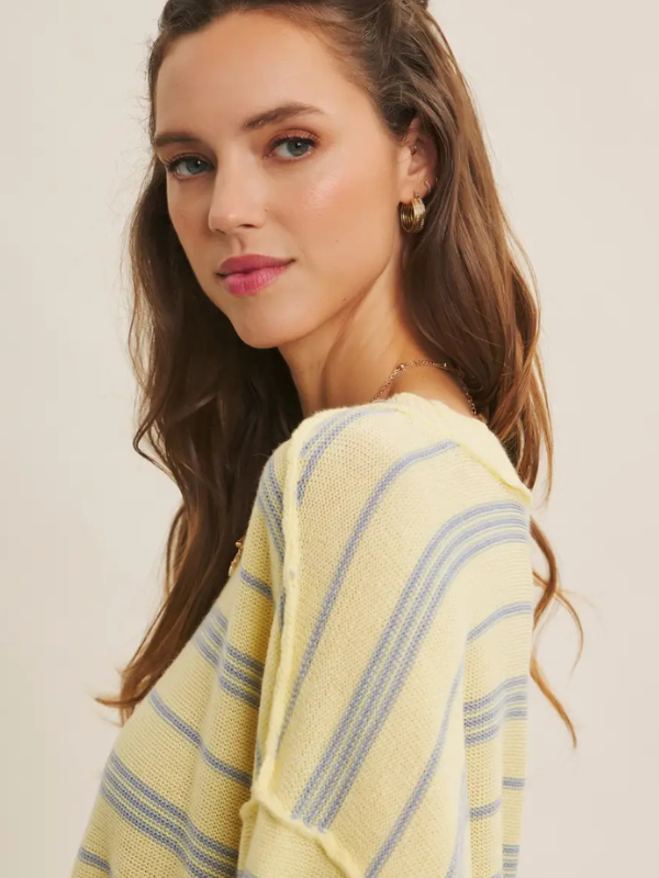 woman wearing yellow top with blue stripe