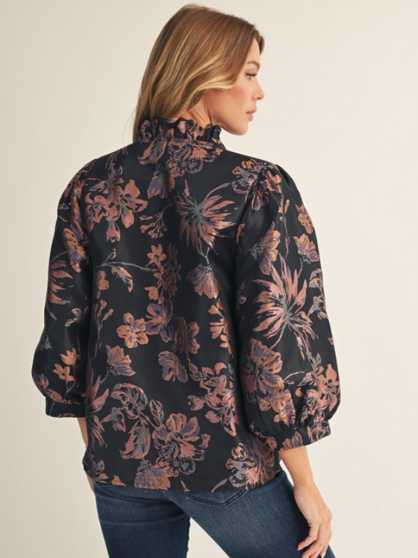 woman wearing mauve and black shirt 