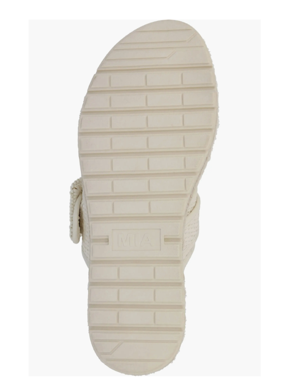 Close-up of a sandal sole with visible brand name on a white background