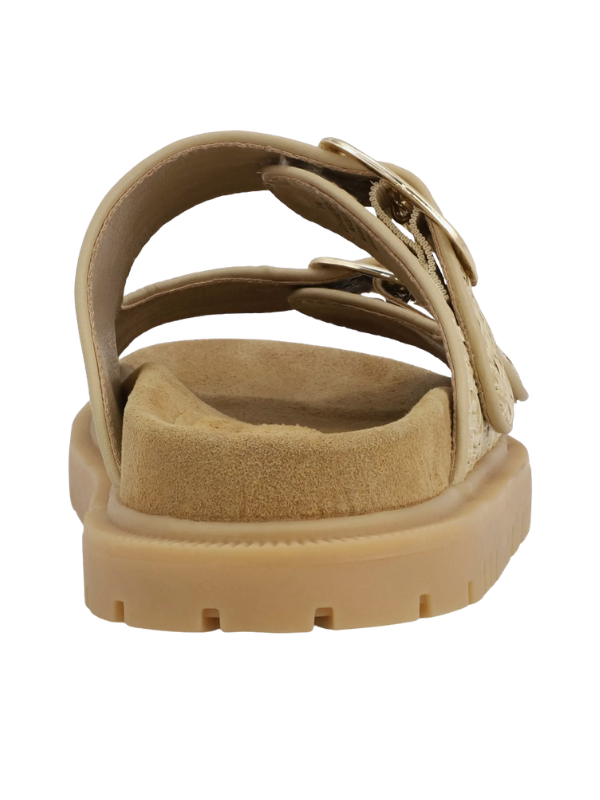 Beige sandal with a thick sole on a white background