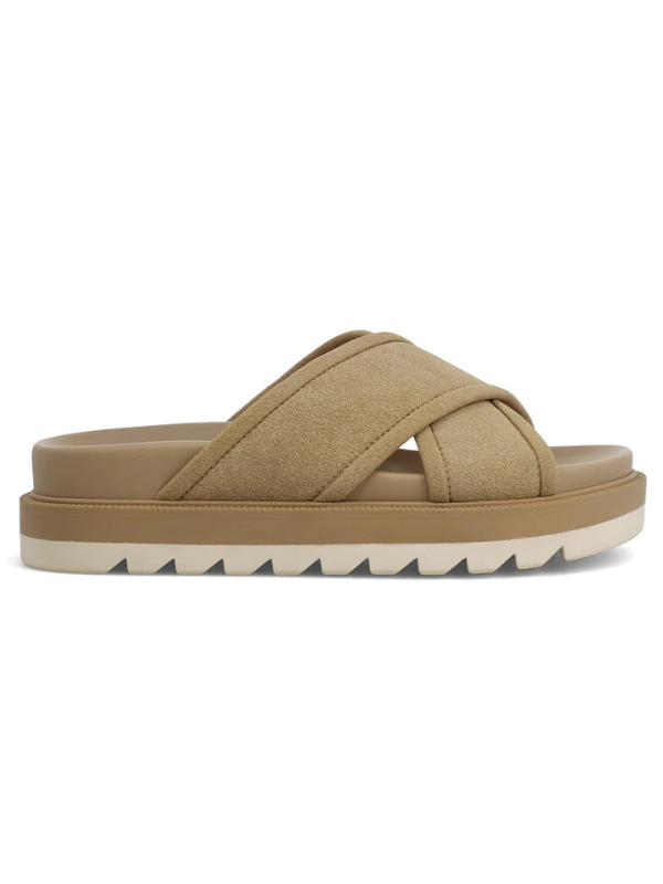 Beige sandal with criss-cross straps on a white background
