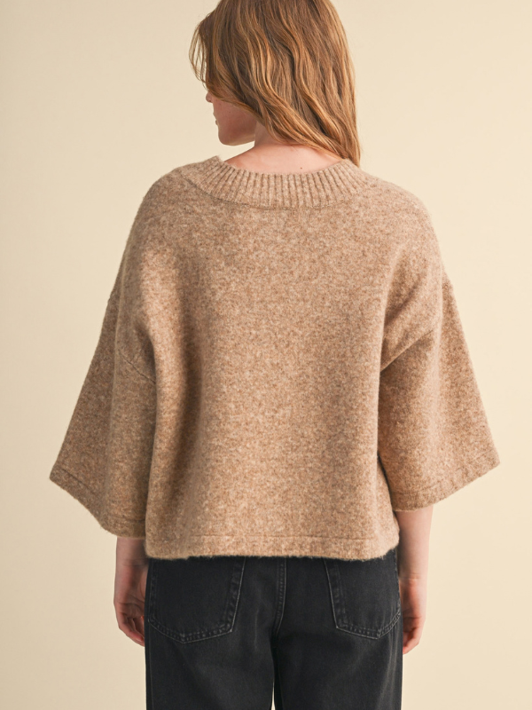 woman wearing a mocha sweater with buttons