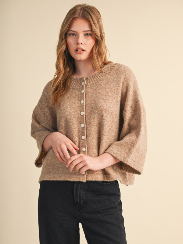 woman wearing a mocha sweater with buttons