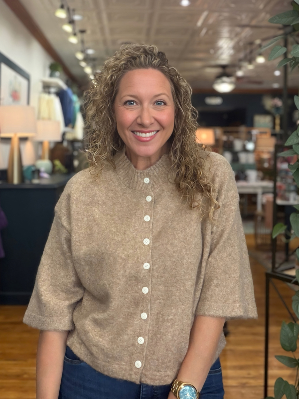 woman wearing a mocha sweater with buttons