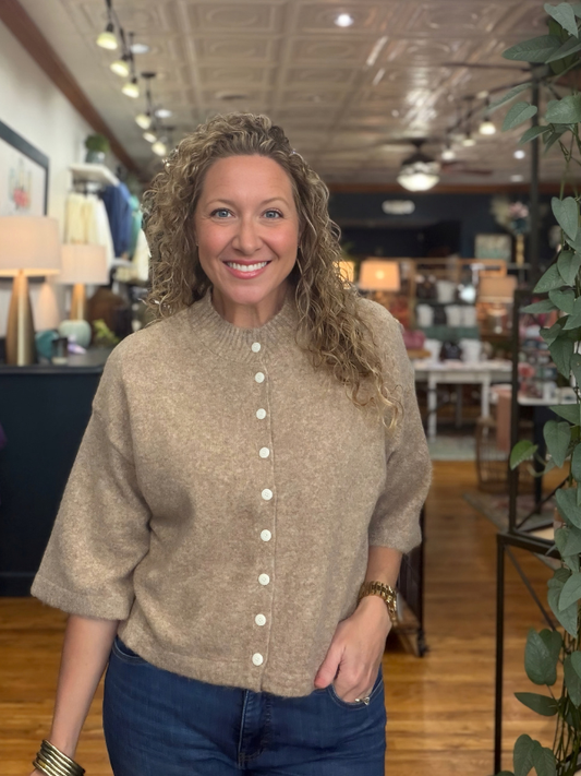woman wearing a mocha sweater with buttons