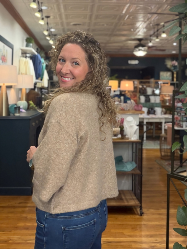woman wearing a mocha sweater with buttons