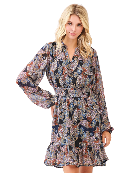 Woman wearing a patterned dress on a white background