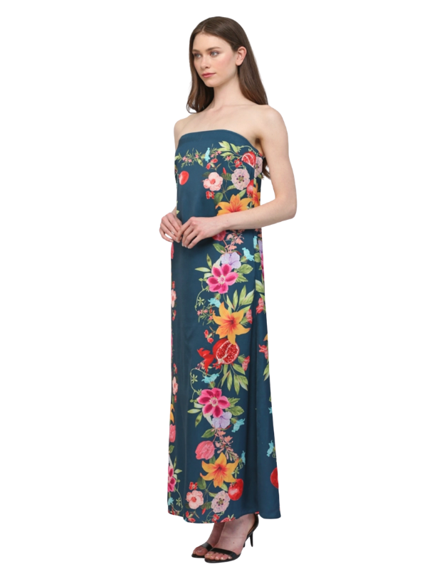 Woman wearing a strapless floral dress on a white background