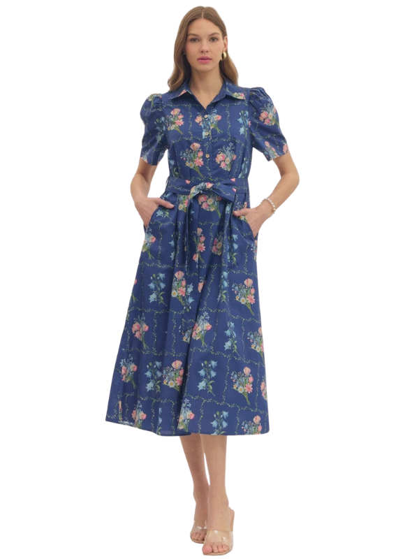 Woman wearing a blue floral dress on a white background