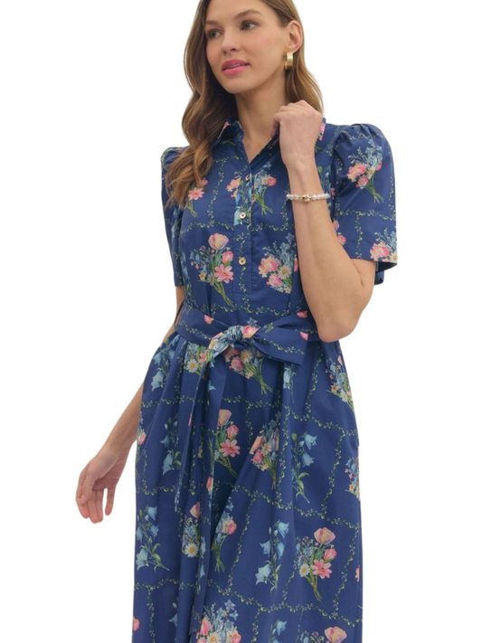 Woman wearing a blue floral dress on a white background