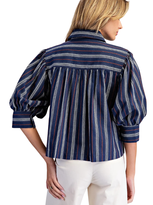 woman wearing navy and brown striped collared top 