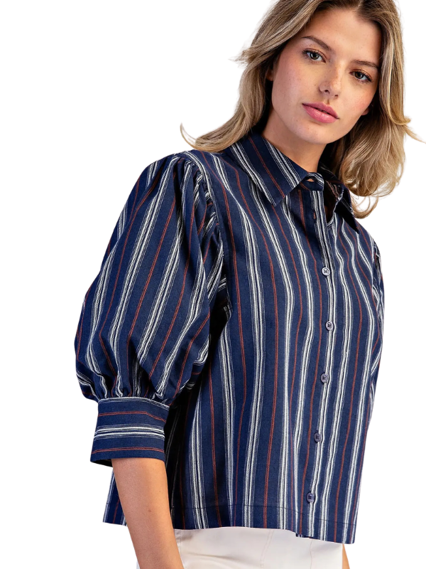woman wearing navy and brown striped collared top 