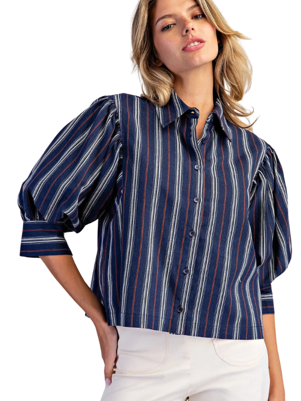 woman wearing navy and brown striped collared top 