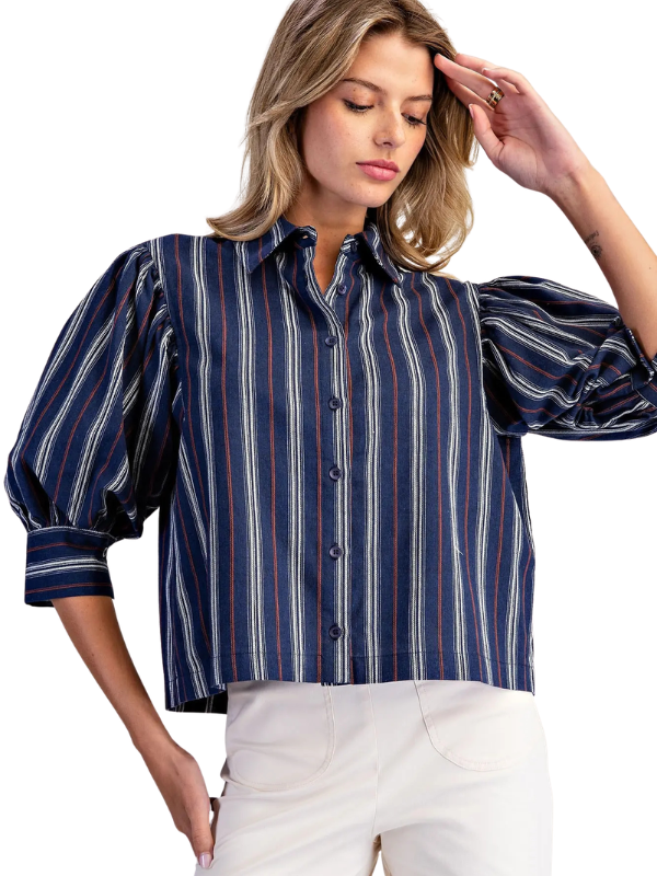 woman wearing navy and brown striped collared top 