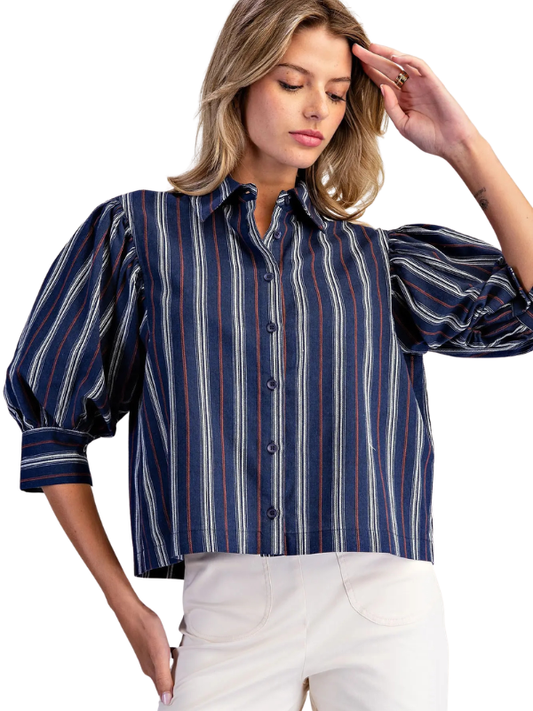 woman wearing navy and brown striped collared top 