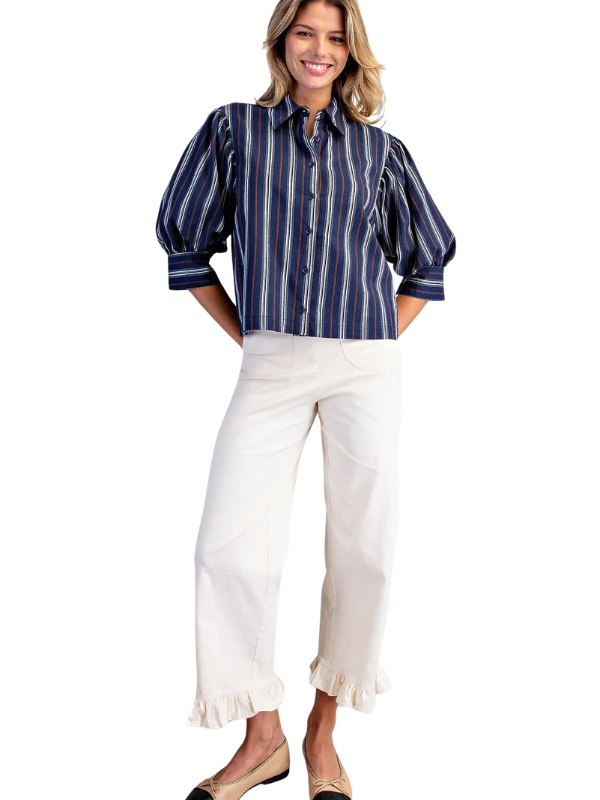 woman wearing navy and brown striped collared top 