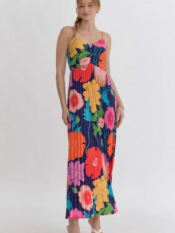 This Floral Print Maxi Dress features a vibrant, pleated design with a flattering V-neck and adjustable straps. The lightweight, non-sheer fabric is perfect for warm weather, and the zipper closure at the back adds a touch of convenience. 