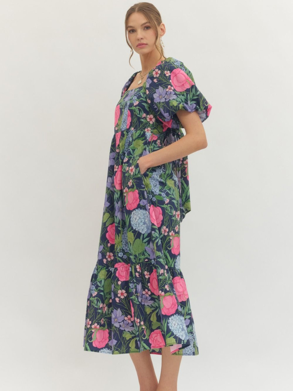 Woman wearing a floral dress on a white background