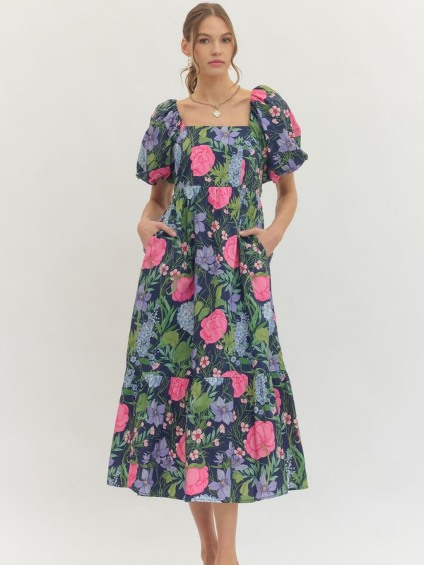 Woman wearing a floral dress on a white background