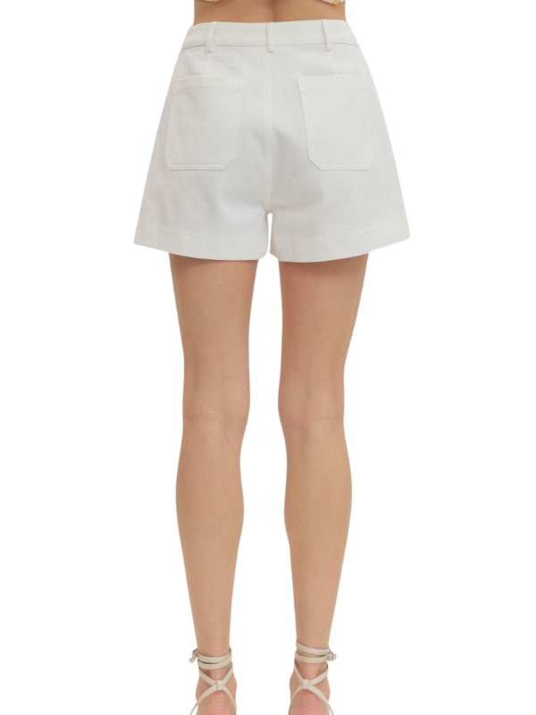 White shorts worn by a person on a white background