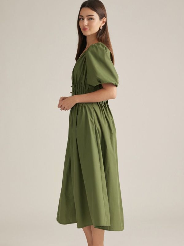 woman wearing an olive midi dress 